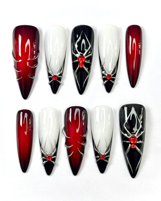 Set de press-on nails inspiré de Little Stranger. Teintes rouges, araignées et esthétique darkromance. Création artisanale Kapsule Nails.